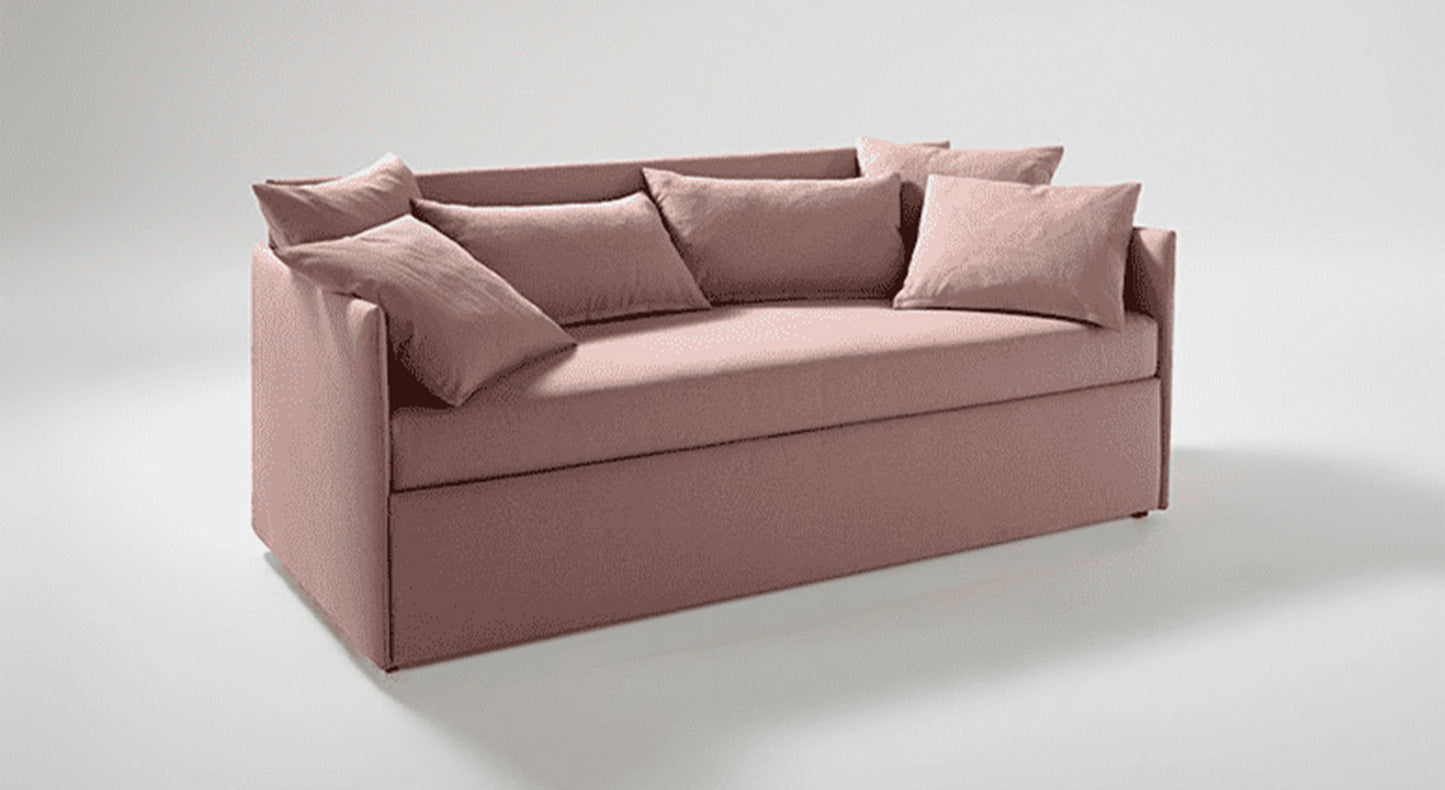 Lit gigogne rose avec coussins, design moderne et ambiance cosy