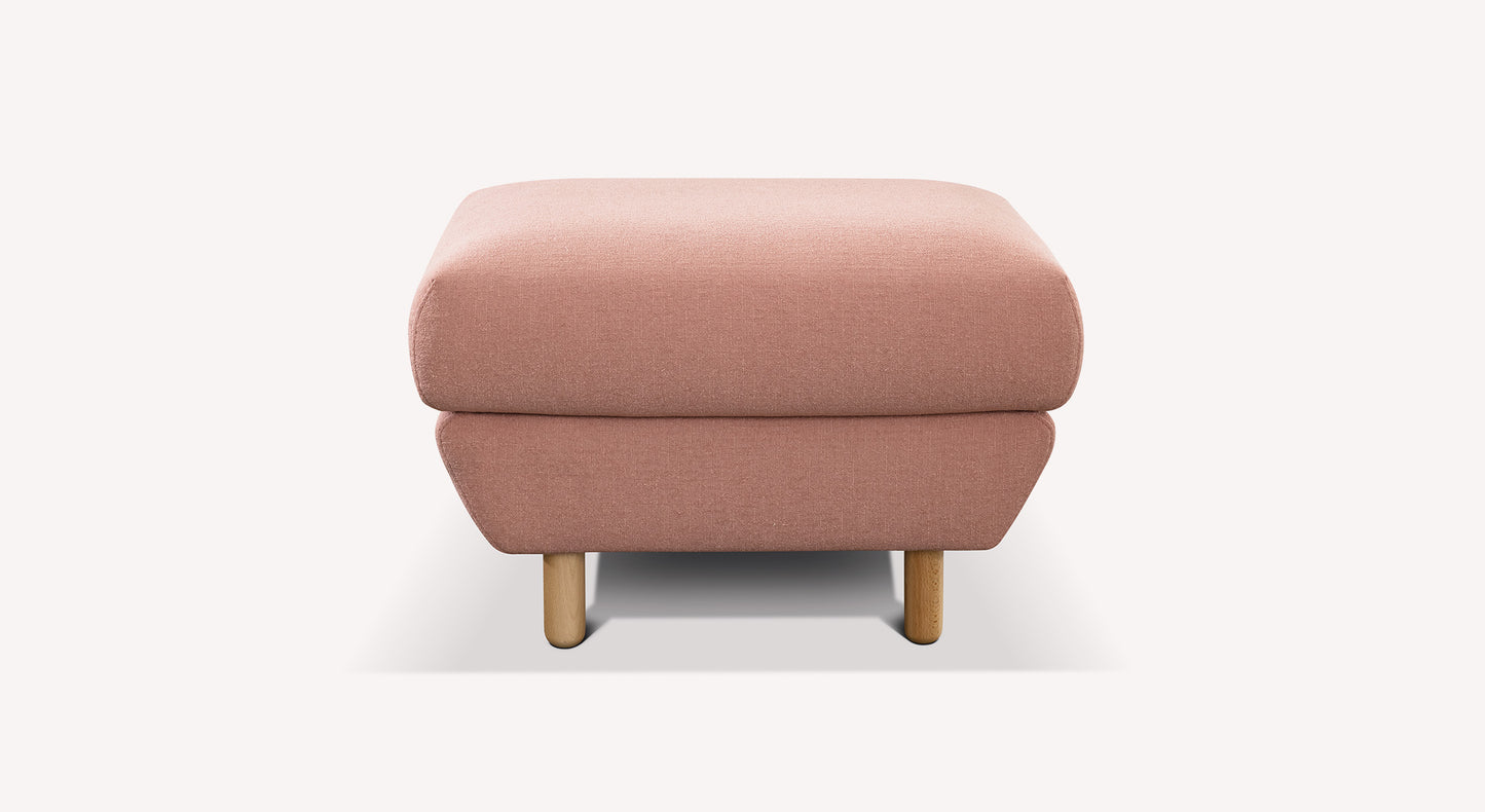 Pouf rose en tissu avec pieds en bois, design moderne et épuré, couleur flamant rose