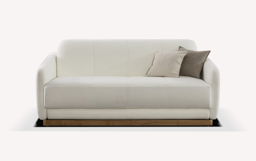 Canapé convertible en tissu blanc neige avec deux coussins, design moderne et base en bois