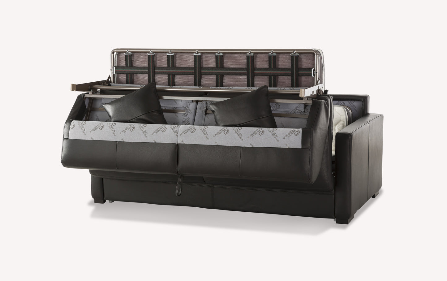 Canapé convertible en cuir noir, modèle Notte Lux, avec mécanisme de dépliage visible et coussins assortis