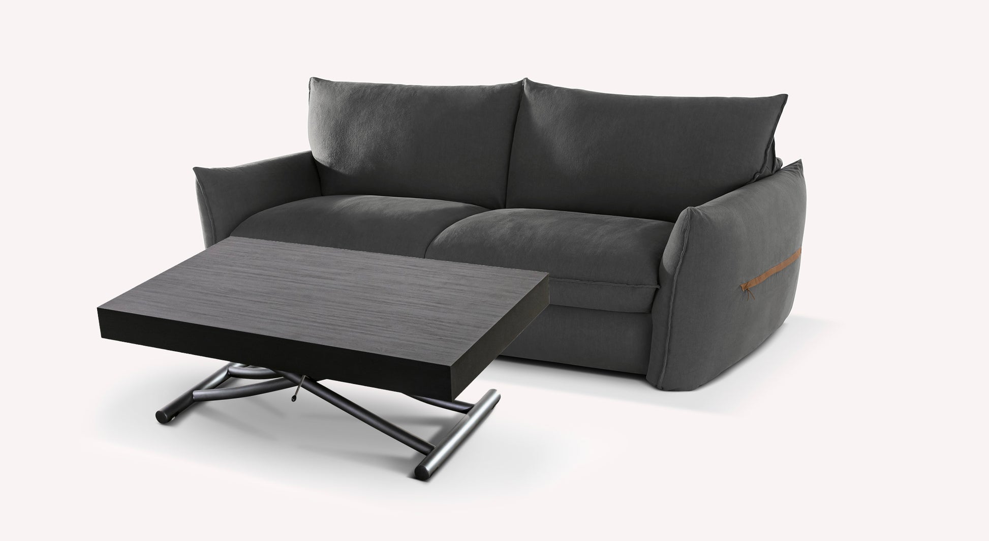 Canapé gris avec accoudoirs larges et table basse en bois foncé sur pieds métalliques, style moderne et épuré