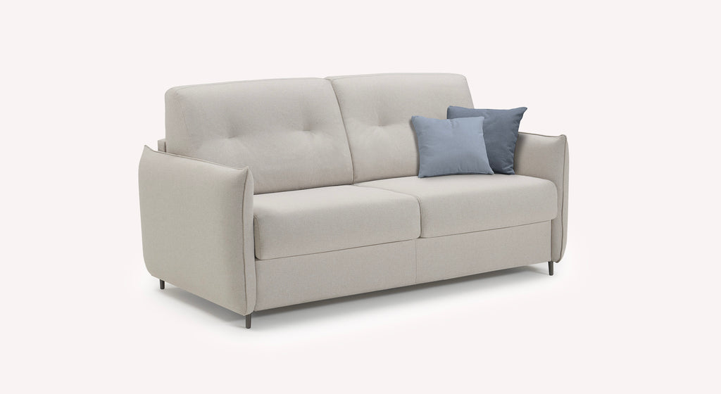 Canapé convertible Tony en tissu ivoire avec coussins bleus