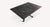 Table pliable en mélaminé gris foncé avec pied métallique noir déployé, design moderne et fonctionnel SHAZAM Mélaminé Pietra.