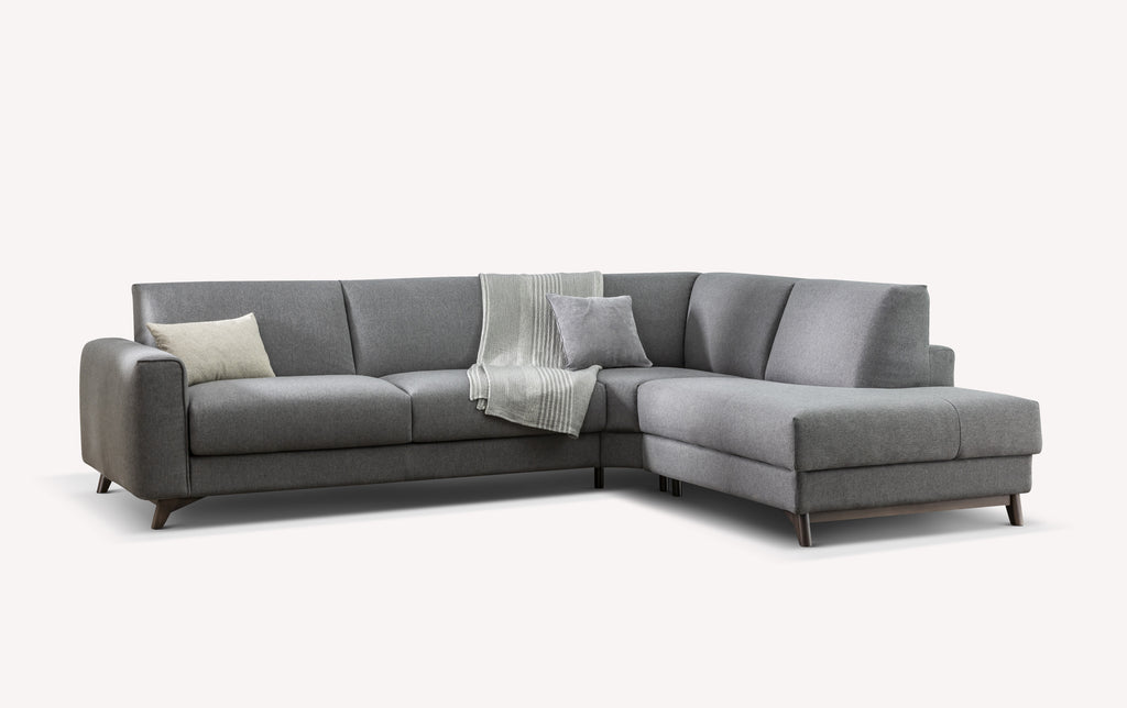 Canapé d'angle convertible en tissu Meraviglia gris, avec coussins et plaid, design moderne et épuré