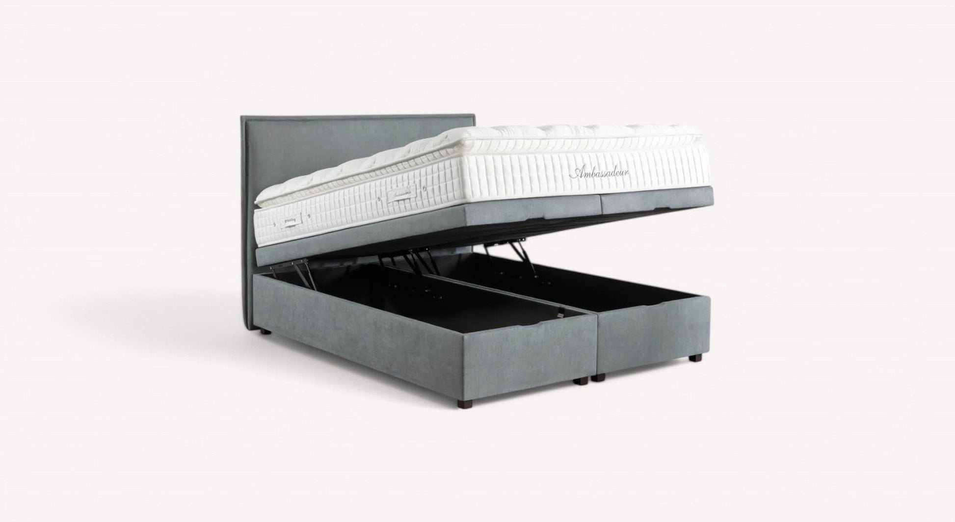 Lit coffre gris modèle Ouessant avec matelas blanc, ouvert pour révéler un espace de rangement