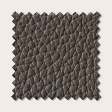Échantillon de tissu texturé marron foncé, aspect luxueux et élégant