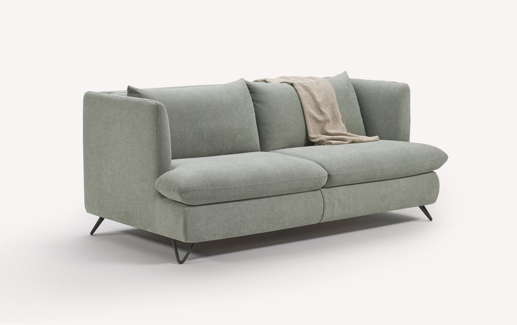 Canapé convertible King en tissu vert lagon avec pieds en métal noir, plaid beige sur l'accoudoir