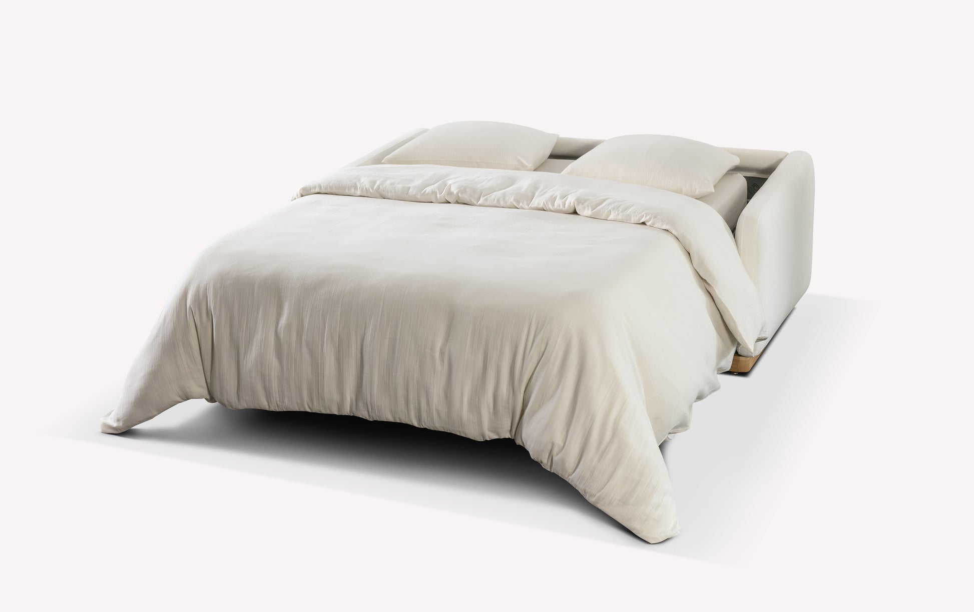 Canapé convertible Koons ouvert en tissu Fluf neige, transformé en lit avec couette et oreillers blancs