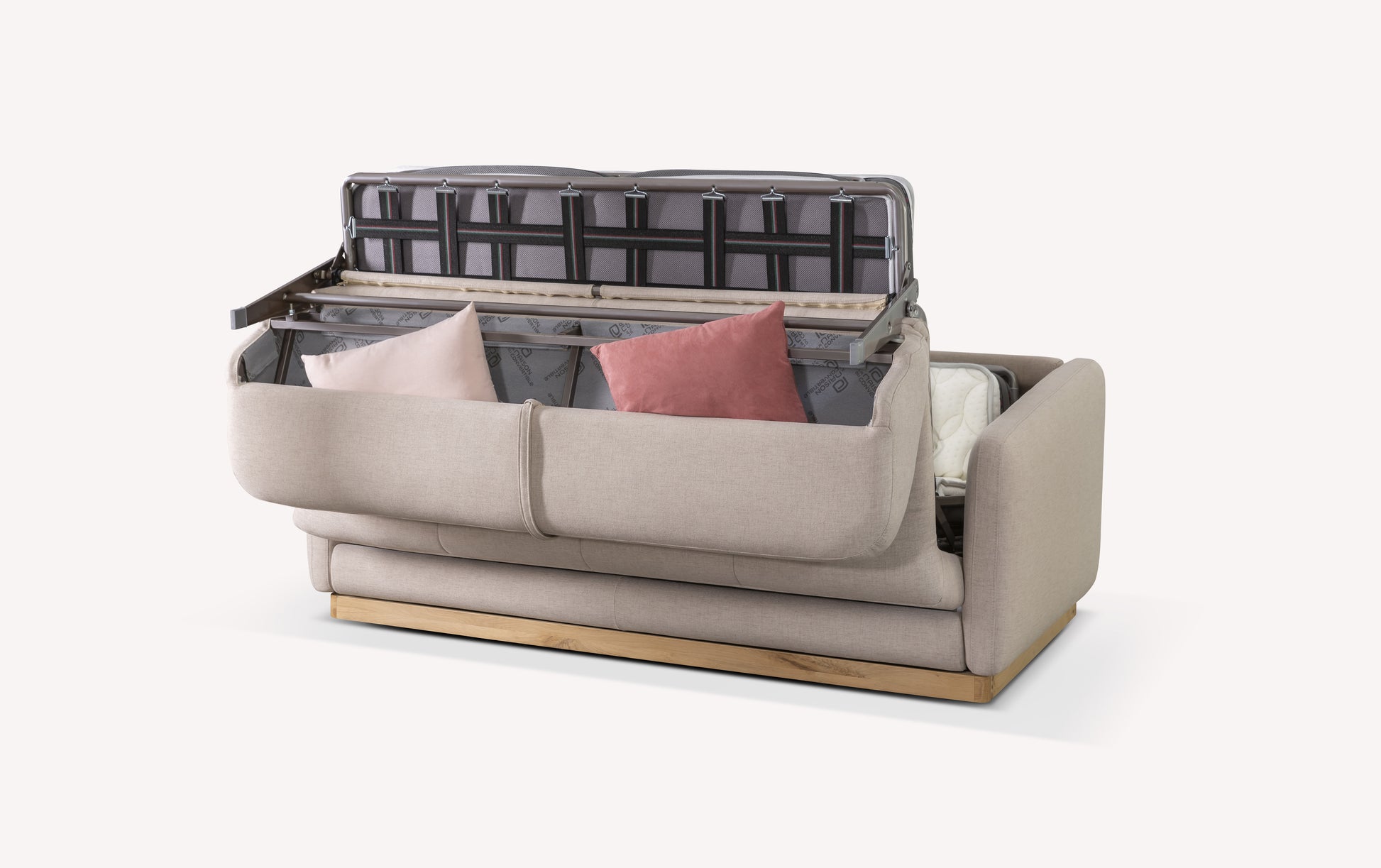 Canapé convertible en tissu mastic avec rangement ouvert, coussins roses et structure en bois visible