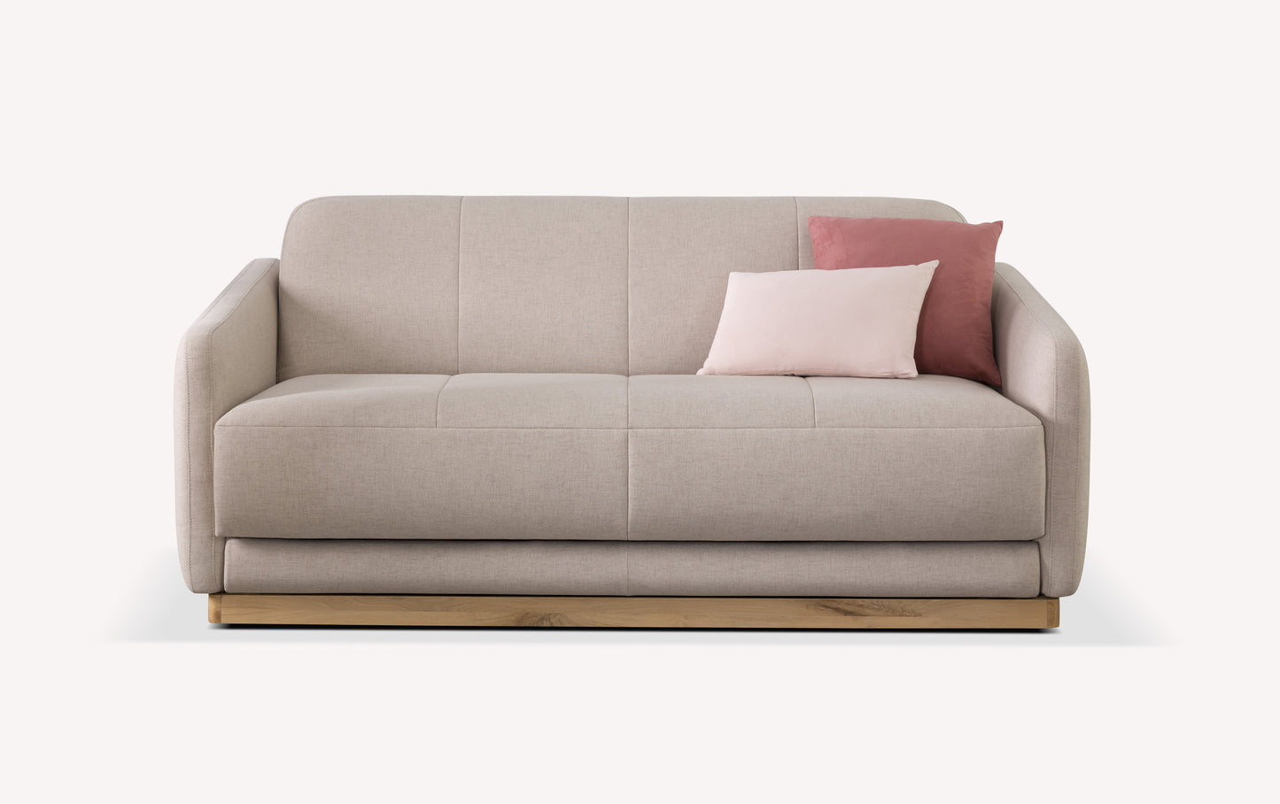 Canapé convertible en tissu mastic avec deux coussins roses, design moderne et base en bois