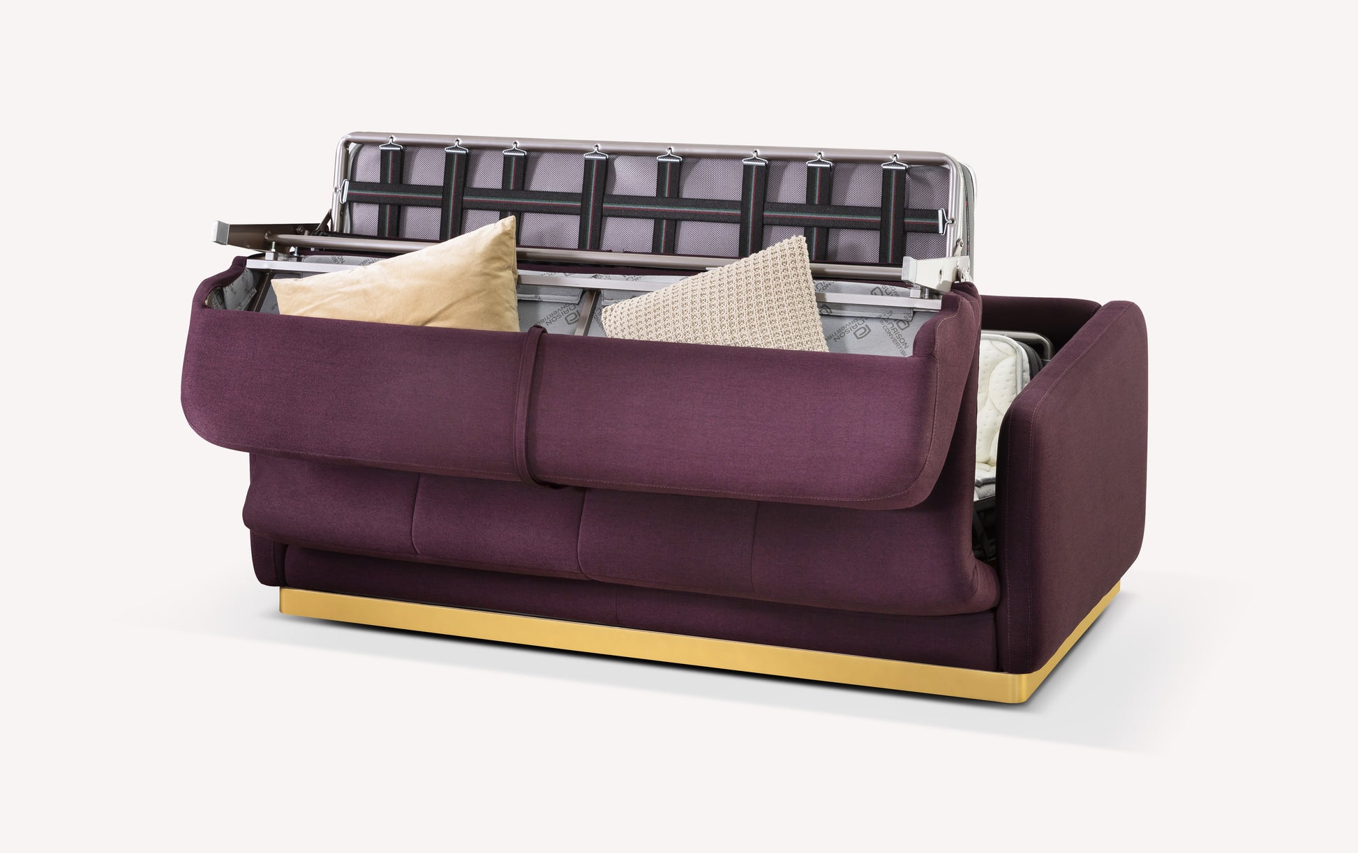 Canapé convertible en tissu violet avec rangement ouvert, montrant des coussins et une structure métallique