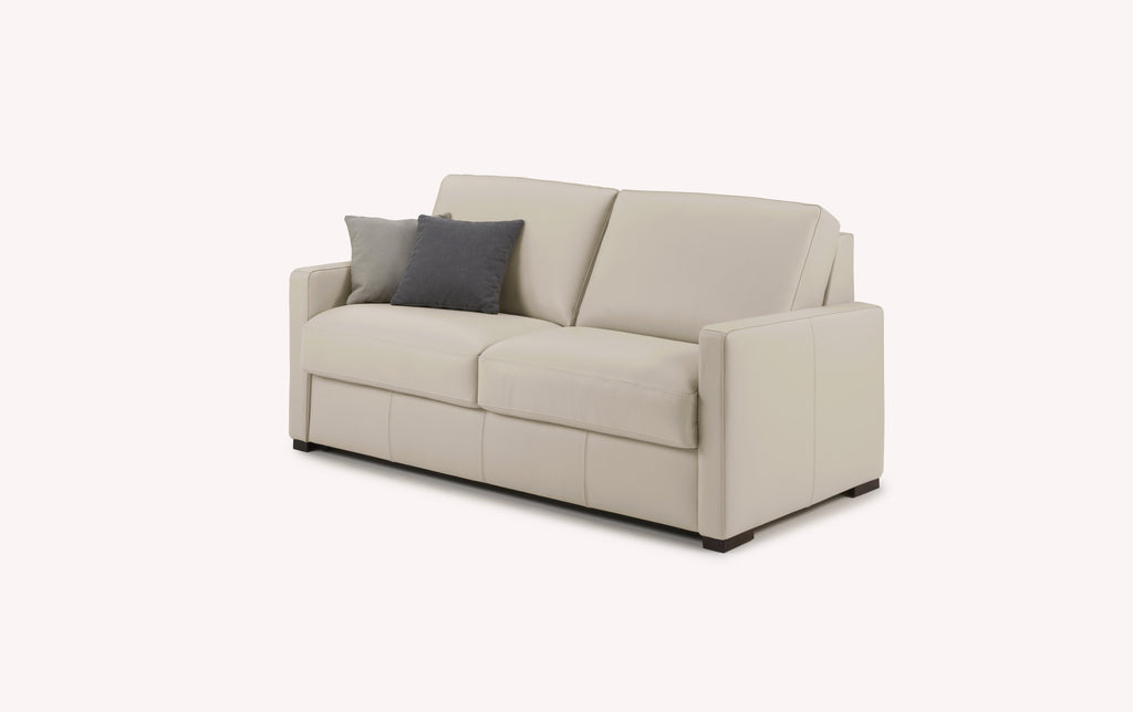 Canapé convertible en cuir avoine, modèle Lyon, avec coussins gris et beige, design moderne et élégant