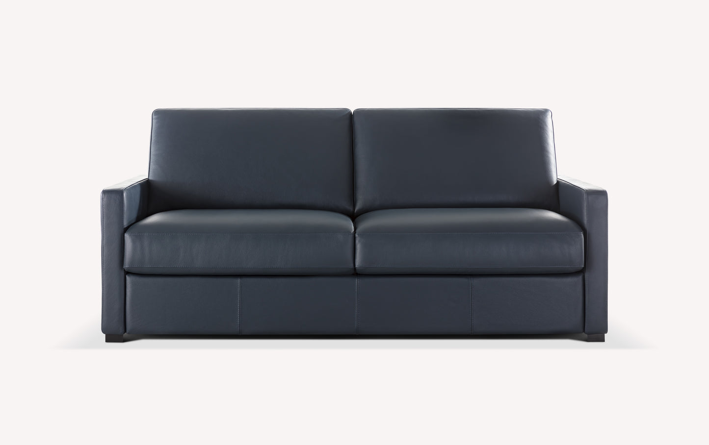 Canapé convertible en cuir bleu foncé, design moderne et luxueux, présenté en packshot sur fond clair