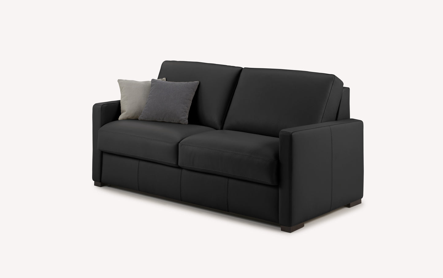 Canapé convertible en cuir noir avec coussins gris et beige, design luxueux