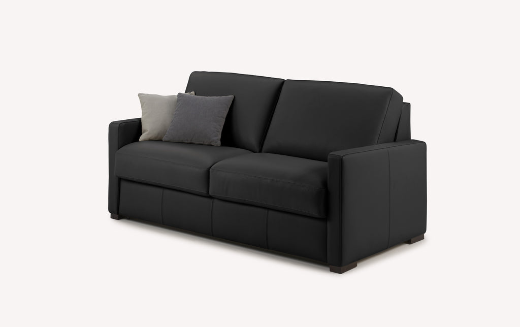 Canapé convertible en cuir noir avec coussins gris et beige, design luxueux