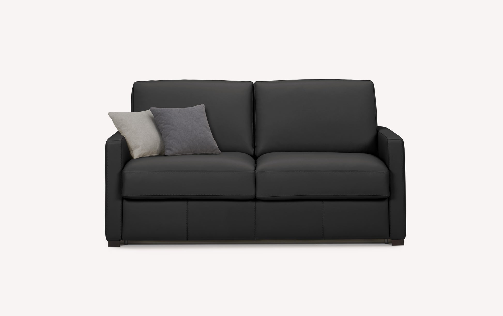 Canapé convertible en cuir noir avec deux coussins gris, style luxueux