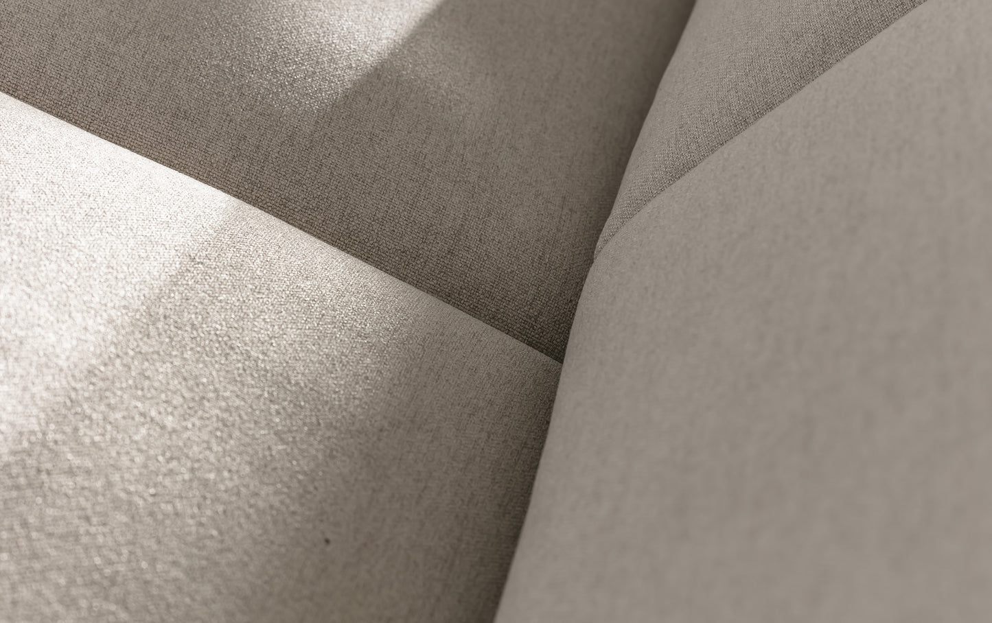 Gros plan sur le tissu mastic d'un canapé convertible, montrant la revêtement et les coutures